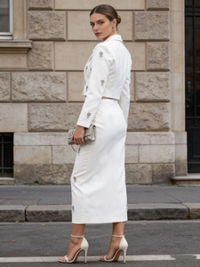 Elegant white two-piece skirt set with floral sequin embroidery and high waist design