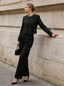 Elegant black two-piece suit set with star sequin cropped jacket and wide-leg trousers