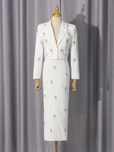 Elegant white two-piece set with silver sequins and long high-waisted skirt for women
