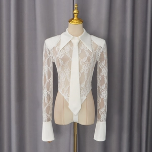 Detailed macro view of white lace bodysuit with collar, tie and sheer texture details
