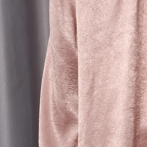 Detail of pink sequin fabric with crinkle texture and silky luster for women's tops