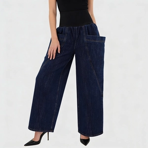 Detail of high-waisted wide-leg jeans with wide elastic waistband and oversized 3D pockets