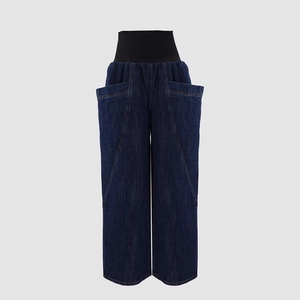 Detail view of high waist wide-leg jeans with elastic waistband and large side patch pockets