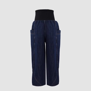 Detail of maternity wide-leg jeans with a high elastic black belly support waistband