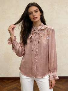 Elegant sequined satin blouse for women with a bow tie collar and ruffled sleeves