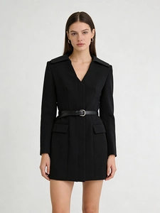 Elegant black long-sleeved blazer dress with belted waist and structured shoulders