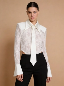 Elegant white lace long sleeve bodysuit with pointed collar and black tailored pants