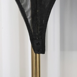 Detail of classic black mesh bodysuit featuring secure double metal snap button closure
