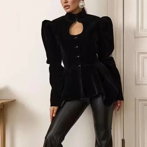 Detail of velvet jacket featuring hollow neck design and elegant peplum waist silhouette