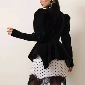 Detail of velvet jacket with puff sleeves and lace hem polka dot skirt set