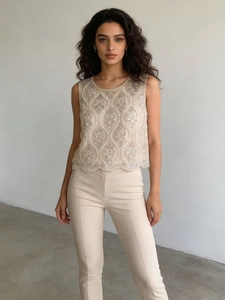 Ensemble haut perlé champagne brodé de feuilles et pantalon ajusté assorti chic