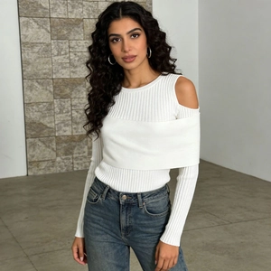 Detail view of white cold-shoulder ribbed knit sweater with unique layered front design