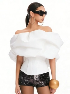 Slim fit white strapless top featuring dramatic cloud-like ruffles and corset design