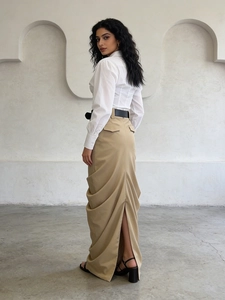 Elegant high-waist straight skirt with back slit and belt in minimalist modern architecture