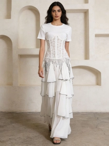 Elegant French-style tiered white mesh midi skirt with black piping and fringe detail