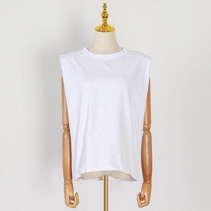 Detailed view of a white padded shoulder sleeveless tank top on a professional mannequin