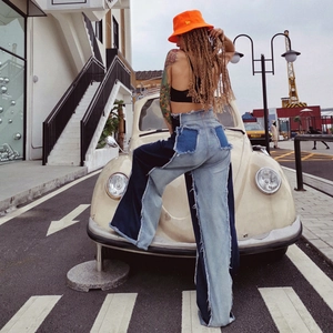 High-waisted patchwork wide-leg flare denim jeans with distressed frayed hem details