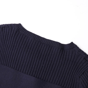 Detailed close-up of dark blue ribbed knit neckline on a slim fit shoulder sweater