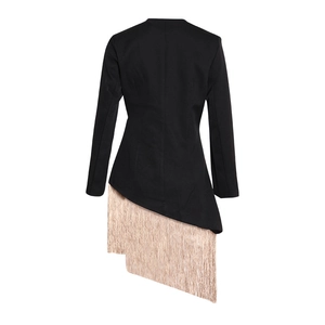Detail of elegant black waist-tie blazer featuring champagne gold tassel asymmetric hem