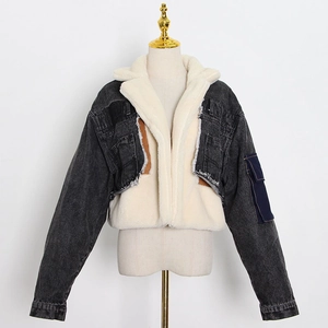 Detailed view of wash denim and plush faux shearling lining on the patchwork jacket