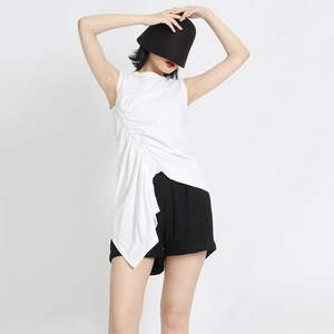 Detail of white sleeveless top featuring drawstring pleats and irregular hem design