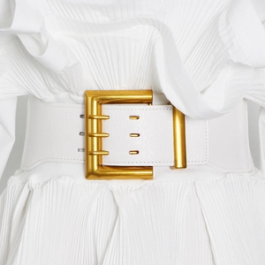 Close-up of white leather wide corset belt featuring a square gold metal buckle