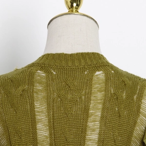 Detail of olive green cable knit sweater with distressed ripped hollow out design