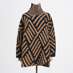 Close-up of plush mink-like knit sweater featuring brown geometric twill patterns