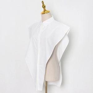 Side view of a white pointed collar shirt dickey with asymmetrical cape-style hem design