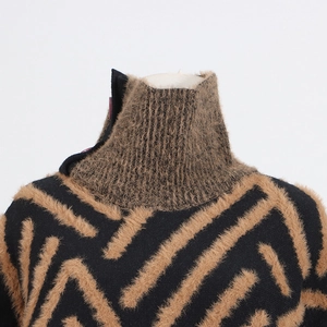 Detail of high neck mink-fleece sweater showing button collar and geometric texture