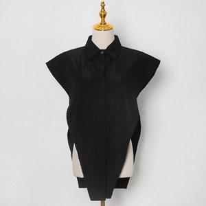 Detail of the sharp pointed hem and structured fabric on this black sleeveless vest top