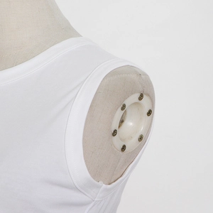 Macro detail of white cotton blend sleeveless top showing round neck and double-stitched seams