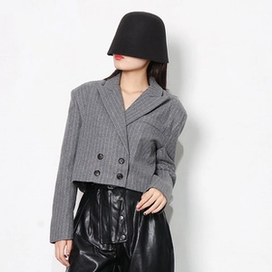 Close-up of a women's dark grey striped double-breasted blazer with minimalist design
