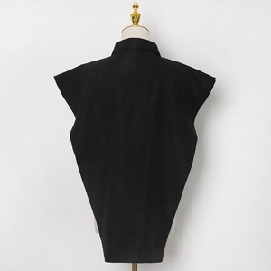 Macro view of structured black sleeveless shirt with inverted triangle silhouette and collar
