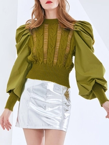 Slim fit olive green knit sweater with puffed sleeves and metallic silver mini skirt