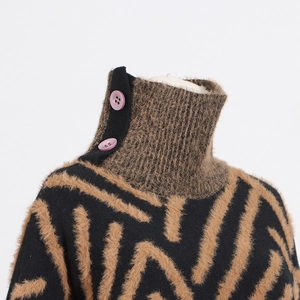 Detail of knit high collar with purple buttons and fuzzy geometric patterns on sweater