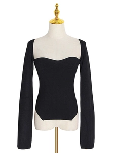 Slim fit black ribbed knit top with sweetheart neckline and irregular side split hem