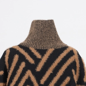 Detail of high collar and soft mink-like texture on a bicolor loose knit sweater