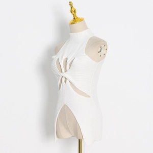 Detail of white knit top featuring high neck, twist hollow cutout, and irregular split hem