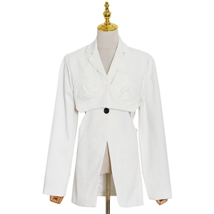 White blazer featuring structural padded shoulders, waist cutouts, and single-button closure