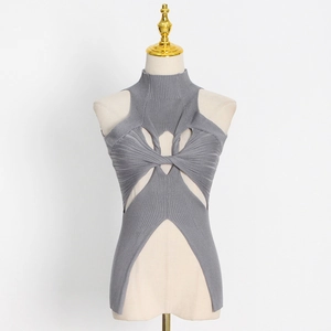 Close-up of grey ribbed knit top featuring hollow-out cutouts and twisted knot design