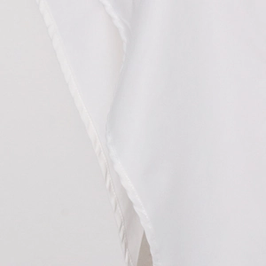 Close-up of white chiffon fabric showing professional hem stitching and delicate texture
