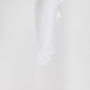 Detail of double-needle stitching on white cotton fabric with fine jersey texture
