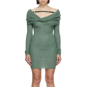 Close-up of the green off-shoulder knit dress with cross knot design and fabric texture