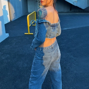 Light blue wash denim two-piece set with off-shoulder long sleeve top and high-waist jeans