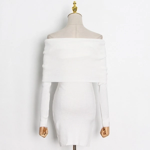 Detail of the off-shoulder neckline and ribbed knit texture of this slim white mini dress