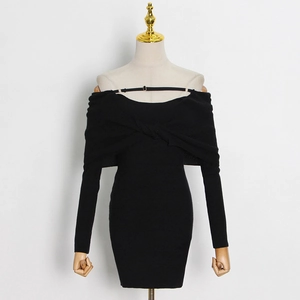 Detail of knot design on black off-shoulder rib-knit dress with thin strap
