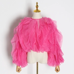 Detailed view of layered pink organza ruffles on a French style elegant blouse