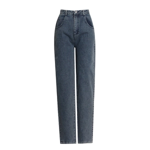 Macro detail of high-waist straight leg jeans in vintage dark blue wash with whiskers