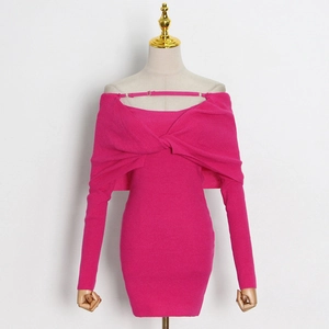 Detail of fuchsia off-shoulder knitted dress featuring halter straps and ribbed texture